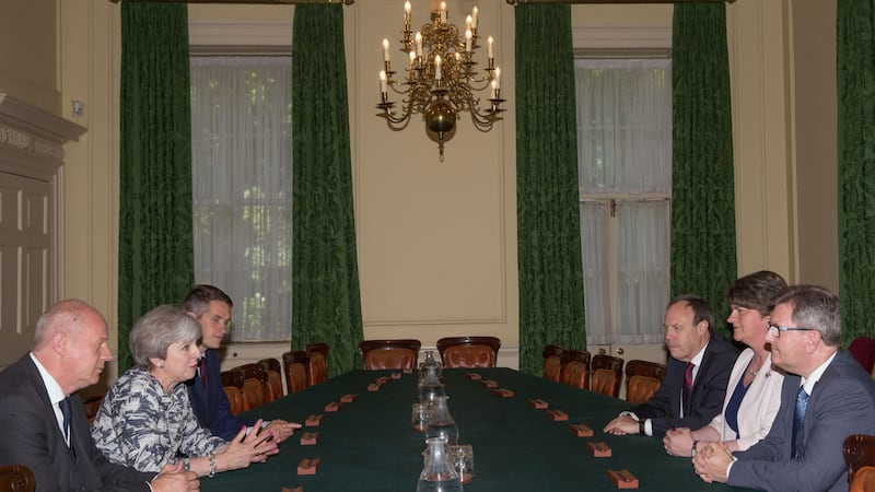 British Prime Minister Theresa May sits with First Secretary of State Damian Green (left), and Parliamentary Secretary to the Treasury, and Chief Whip, Gavin Williamson (third left) as they talk with DUP leader Arlene Foster (second right), DUP Deputy Leader Nigel Dodds (third right), and DUP MP Sir Jeffrey Donaldson inside 10 Downing Street, London. The DUP has agreed a deal to support the minority Conservative government&nbsp;