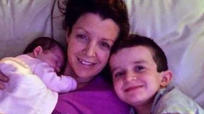 Louise James with baby Rioghnach-Ann, who survived the tragedy, and son Evan (8), who lost his life 