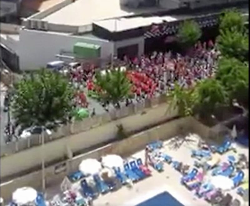 Holiday makers and ex-pats join in the Twelfth of July parade in Benidorm. 