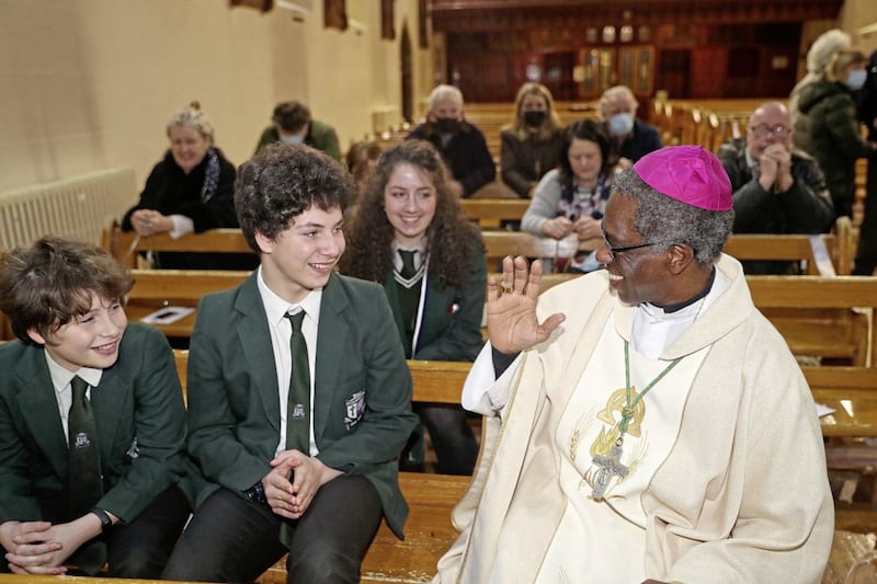 St Colmcille&#39;s High School, Crossgar pupils Thomas (year 8), Gerard (year 9) and Grace (year 12) receive a blessing from the Papal Nuncio to Ireland, Archbishop Jude Thaddeus Okolo at the novena to St Patrick in Saul. Picture by Bill Smyth. 