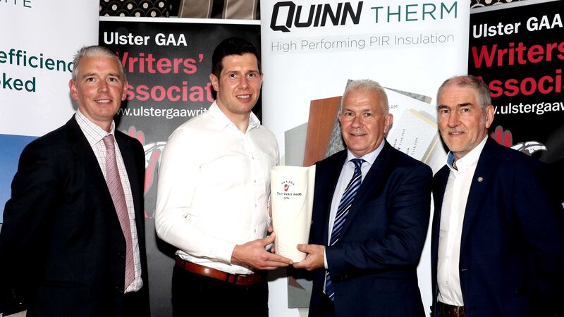 Seamus McMahon of Quinn Building Products presents Sean Cavanagh with his Belleek vase as the July winner of the Ulster GAA Writers merit award. Also pictured are UGAAWA chair John Martin and Tyrone manager Mickey Harte<br />Picture by Peadar McMahon&nbsp;