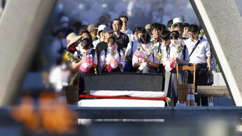Visitors paid their respects at a cenotaph dedicated to the victims of the atomic bombing in the Hiroshima Peace Memorial Park (Kyodo News/AP)