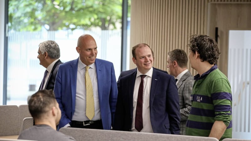 Economy Minister Gordon Lyons (centre) visits The Bank of London's new Belfast offices. Also pictured is Jim Ditmore, the fintech firm's group chief operating officer. 