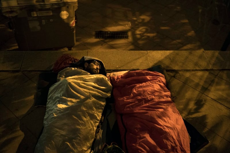 Pro-referendum supporters sleep at a school listed to be a polling station by the Catalan government (Felipe Dana/AP)