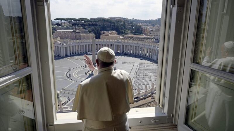 The coronavirus lockdown meant that St Peter&#39;s Square was eerily empty when Pope Francis delivered his traditional blessing at the Vatican on Sunday. Picture by Vatican News via AP 