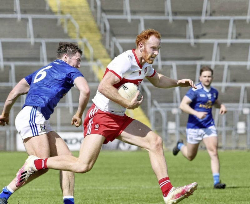 Cavan Oisin Kiernan with Conor Glass of Derry during the National Football League Div 3 match at Kingspan Breffni Park Cavan on Saturday 29th May 2021. Picture Margaret McLaughlin. 