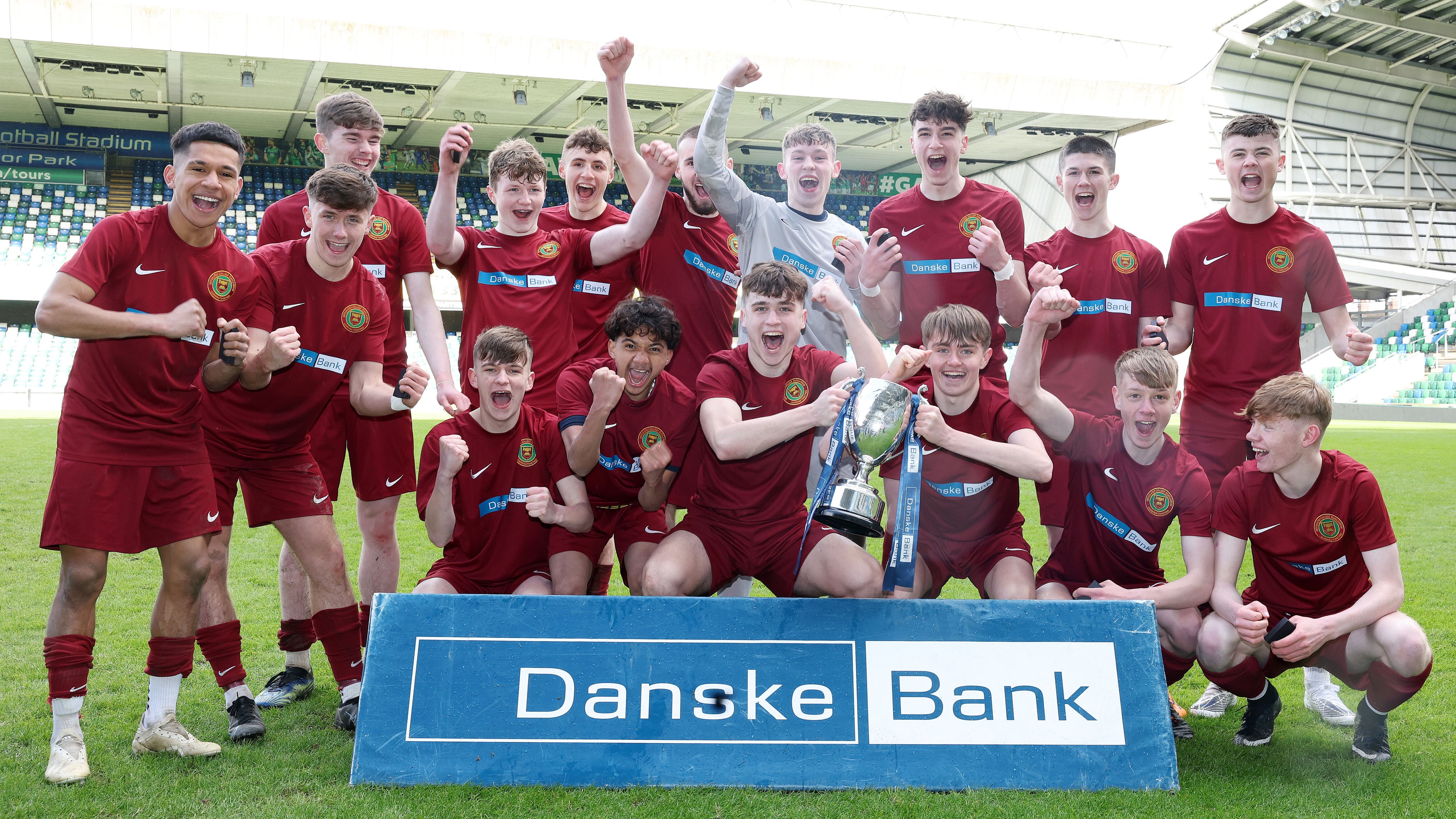 The Integrated College Dungannon players celebrate their NI Schools' FA U18 Cup Final win over St Columb's College, Derry.