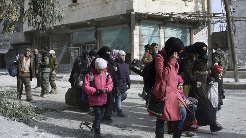 &nbsp;In this photo released by the Syrian official news agency, SANA, residents flee east Aleppo as government forces pushed into rebel-held areas, Syria on December 12 2016