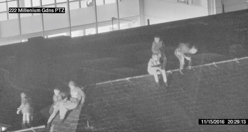 Groups of young people have been captured on CCTV sitting on roof tops at the Royal Victoria Hospital. Picture from Belfast Trust 