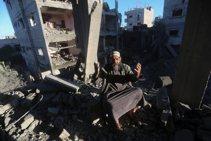 A Palestinian reacts after an Israeli strike on residential buildings in Rafah, Gaza Strip, on Friday (Hatem Ali/AP)