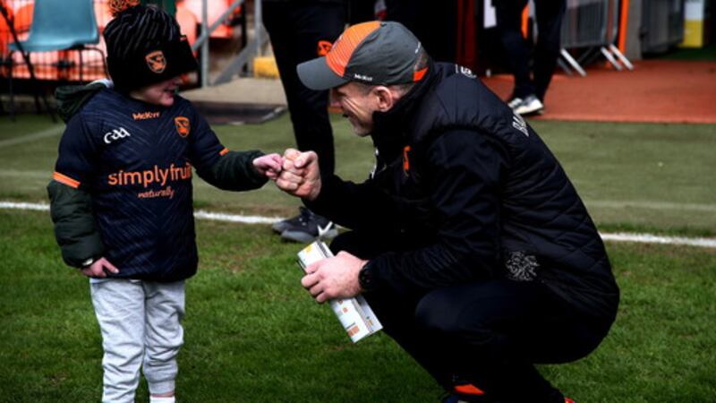 Young Dáithí Mac Gabhann pictured meeting Armagh manager Kieran McGeeney at Saturday's Ulster Championship clash with Antrim. Picture by Seamus Loughran