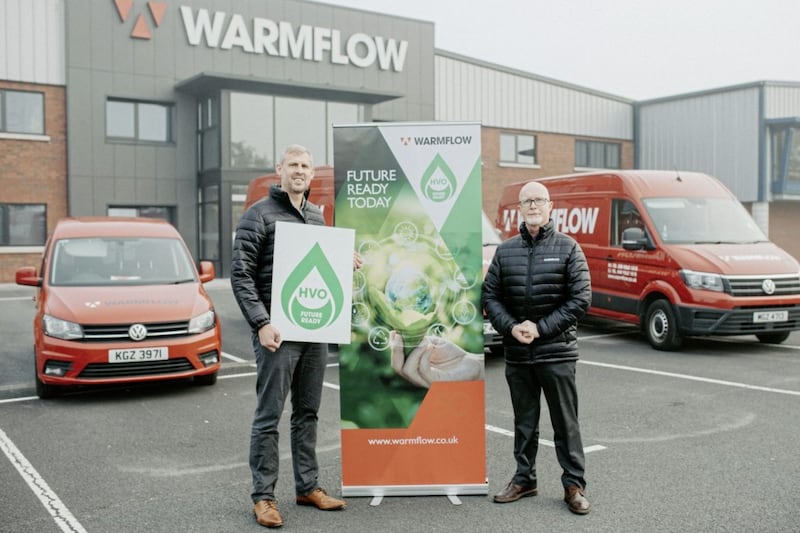 Brian Beattie and Oliver Cormican from Warmflow, pictured with the Lisburn firm&#39;s HVO adapted vans. 