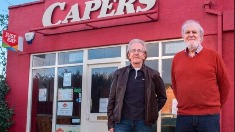 Willie Marshal and Mike Lyle outside Capers pizzeria in east Belfast, which will close on St Patrick's Day. PICTURE:CAPERS/FACEBOOK
