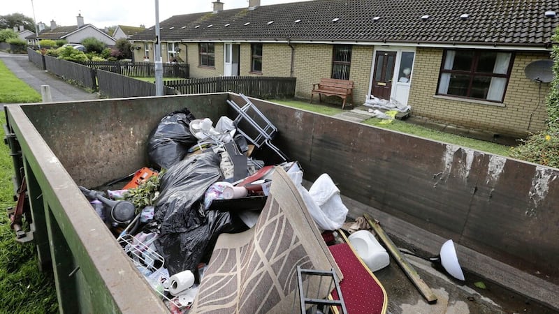 Scene in Eglinton village where residents put their possessions into a skip after getting household contents destroyed during severe flooding. Picture by Margaret McLaughlin 