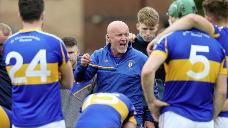 Rossa hurling manager Colly Murphy speaks to his team after their draw with Dunloy on Sunday. Picture by Mal McCann 