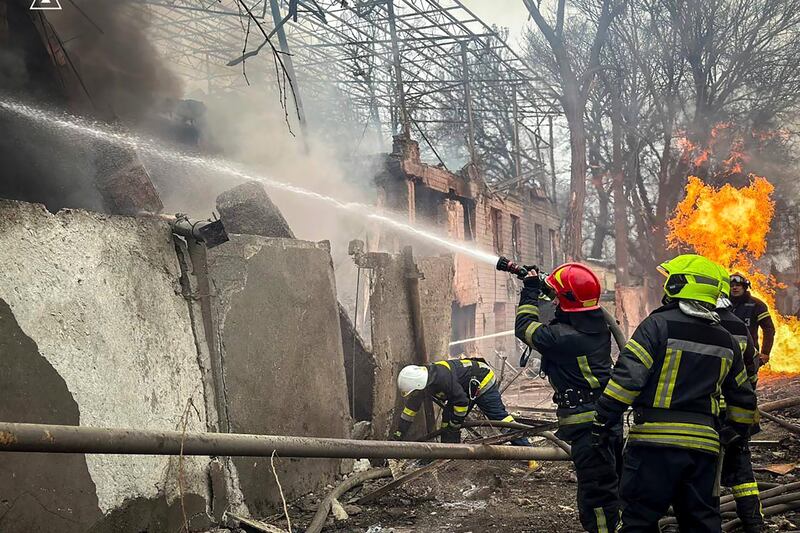 Firefighters extinguish a fire at the scene of a Russian attack in Odesa (Ukrainian Emergency Service via AP)