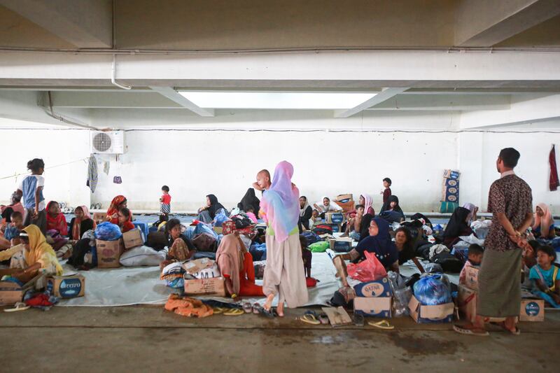 Ethnic Rohingya people take shelter in the basement of a building in Banda Aceh, Aceh province, Indonesia, on Thursday (Reza Saifullah/AP)