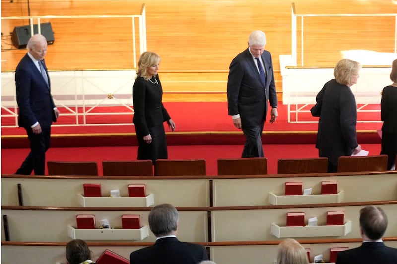 President Joe Biden, left, first lady Jill Biden, for President Bill Clinton and former first lady Hillary Clinton, right, arrive to attend a tribute service for former first lady Rosalynn Carter at Glenn Memorial Church in Atlanta
