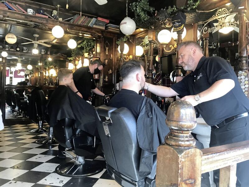 Seán Lawlor and his colleague Shane in the traditional surrounds of Cambridge Barber Shop on Belfast's Lisburn Road.
