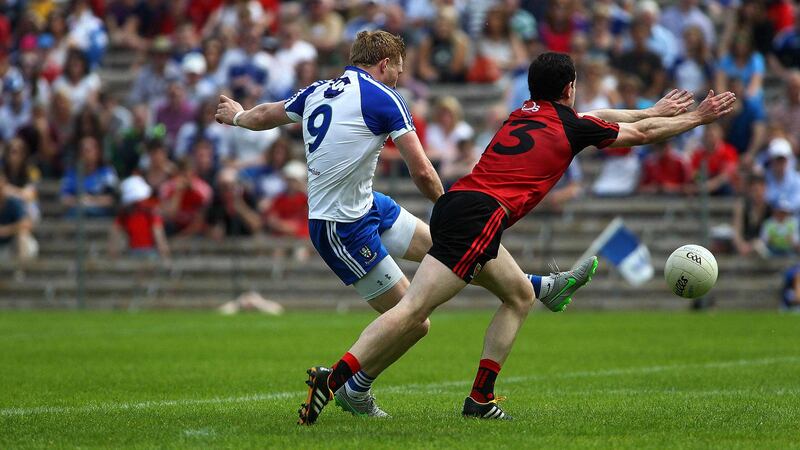 &nbsp;Monaghan's Kieran Hughes comes under pressure from Down's Gerard McGovern in Clones