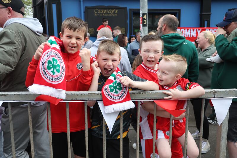 Cliftonville Players celebrate with the fans during an open top bus tour across Belfast after winning the Irish Cup oat Windsor on Saturday.
PIC COLM LENAGAN