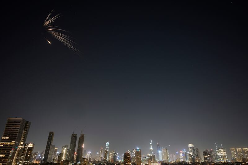 Missiles launched from Iran streak across the sky over central Israel (Ohad Zwigenberg/AP)