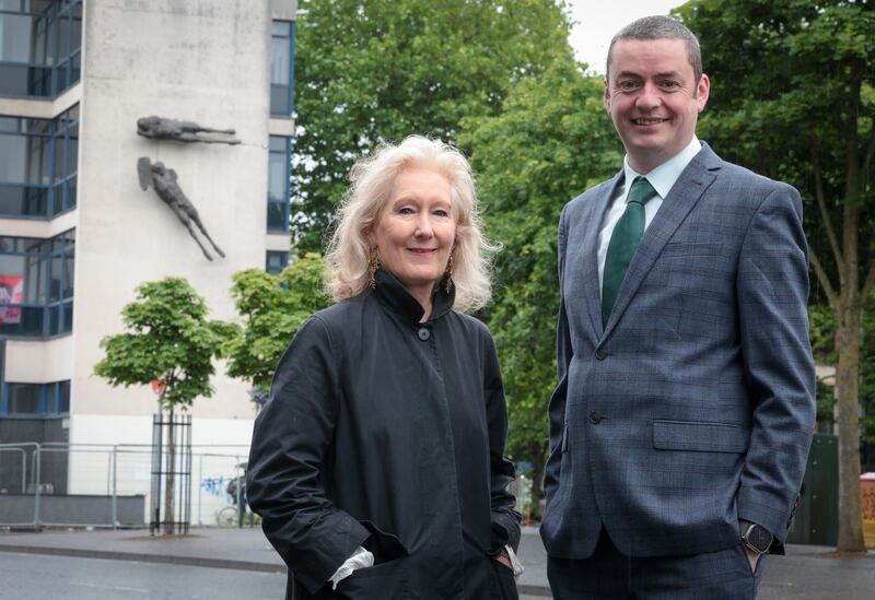 Anne Stewart, Senior Curator of Art at National Museums NI, at the works before their removal with John Ferris, Regional Board Member, Ulster Bank.
