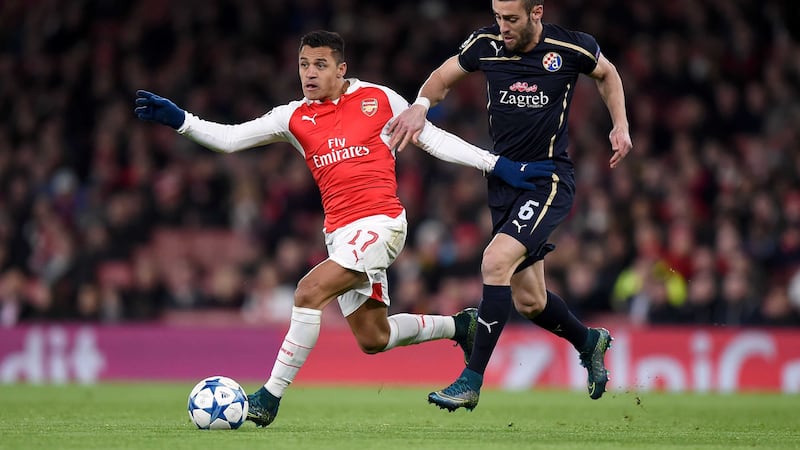 Arsenal's Alexis Sanchez gets away from Dinamo Zagreb's Ivo Pinto during Tuesday night's Champions League Group F match at the Emirates<br />Picture by PA