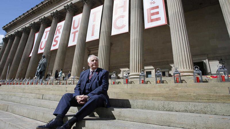 Trevor Hicks, whose daughters Sarah and Vicki died in the Hillsborough disaster, sits on the steps of St George&#39;s Hall in Liverpool, where there is a giant banner and candle lit for each of the 96 Liverpool fans who died as a result of the Hillsborough disaster PICTURE: Peter Byrne/PA 