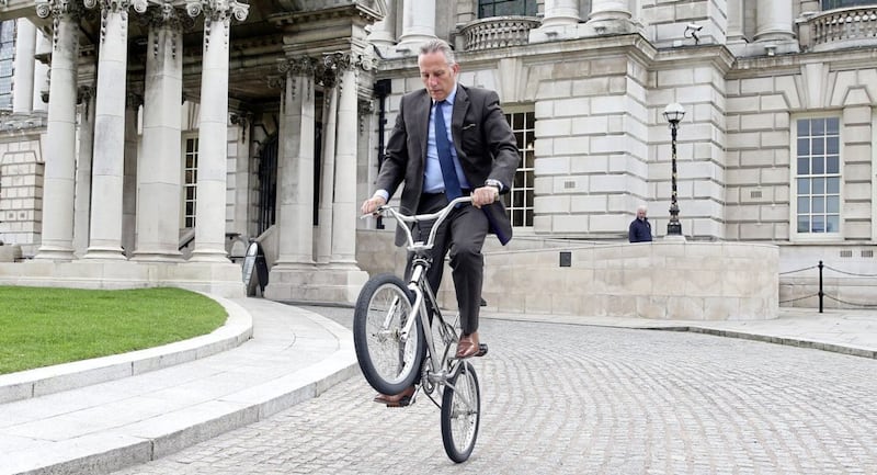North Antrim MP Ian Paisley pulls a wheelie on a BMX at the Bike to Work Day event in Belfast. Picture by Mal McCann