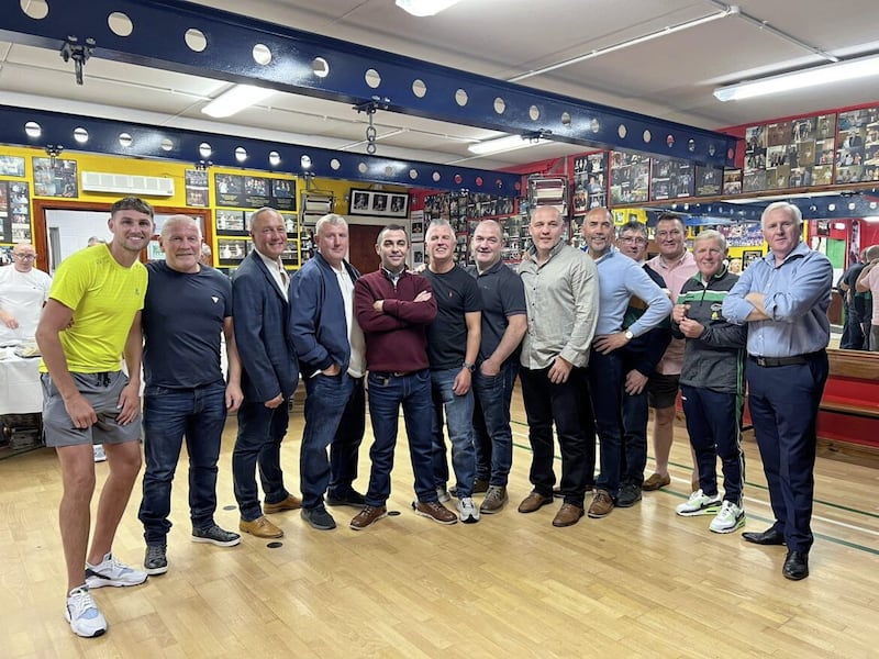 Holy Trinity stalwarts gather for the club's 50th Anniversary Big Picture Show at their in Turf Lodge clubrooms on October 22 2022. Pictured are, from left, Sean McComb, Jim Webb, John Erskine, Eddie Fisher, David Madden, Jim Conlon, Francie Webb, Brian Magee, David Irving, Jim Hynes, Damien Denny, coach Michael Hawkins and secretary Thomas Hawkins 