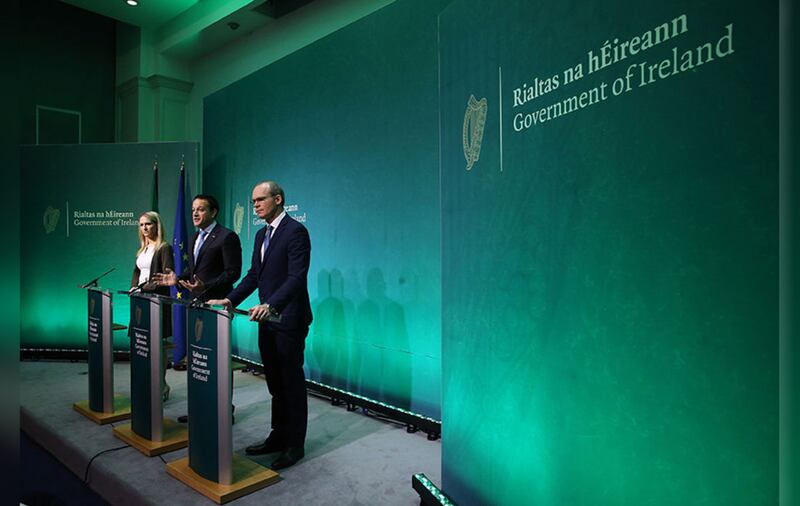 Taoiseach Leo Varadkar (centre), T&aacute;naiste Simon Coveney (right) and Minister for European Affairs Helen McEntee speaking at the Government Press Centre in Dublin after the European Commission announced that &quot;sufficient progress&quot; <br />has been made in the first phase of Brexit talks. Picture by&nbsp;Brian Lawless, PA Wire