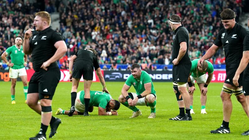 Dejected Ireland players following their defeat to New Zealand in the quarter-final of the Rugby World Cup