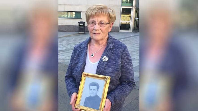 Henry Thornton's widow Mary, stands outside Belfast Coroners' court as she holds a picture of her late husband, who died almost instantly when a soldier shot him twice through the rear of his Austin works van close to Springfield Road police station in west Belfast in August 1971. Picture by David Young, Press Association&nbsp;