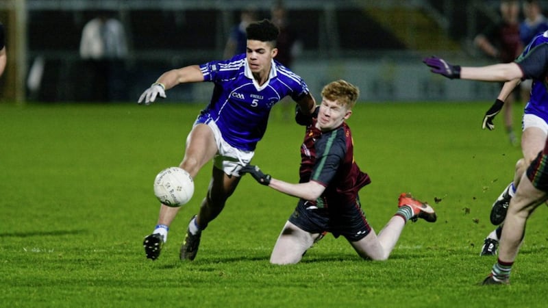 Conor Turbitt of St Ronan&#39;s is beaten to the ball by Finn McElroy of St Colman&#39;s Picture by Jim Dunne 