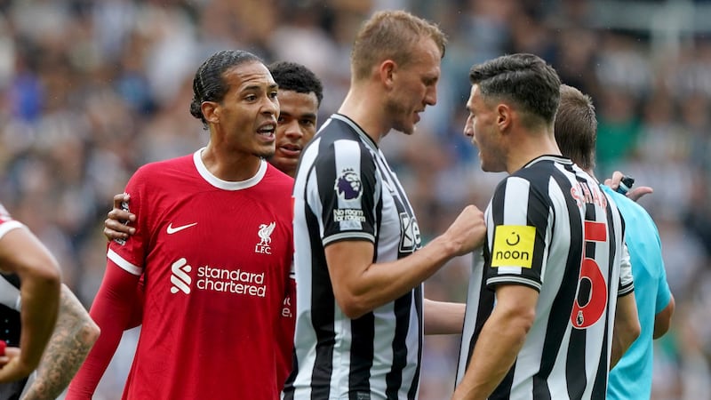 Liverpool’s Virgil van Dijk (left) received an additional ban and a £100,000 fine for his sending-off at Newcastle (Owen Humphreys/PA)