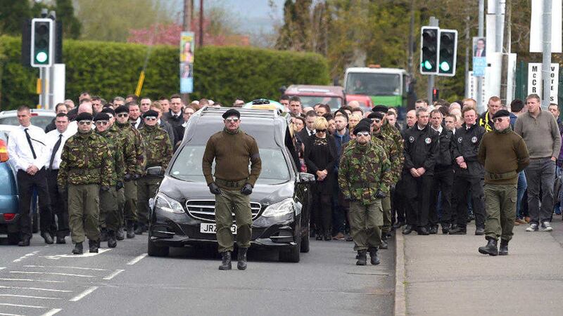 Men in military-style clothing flanked the coffin of Mickey Barr in Strabane yesterday 