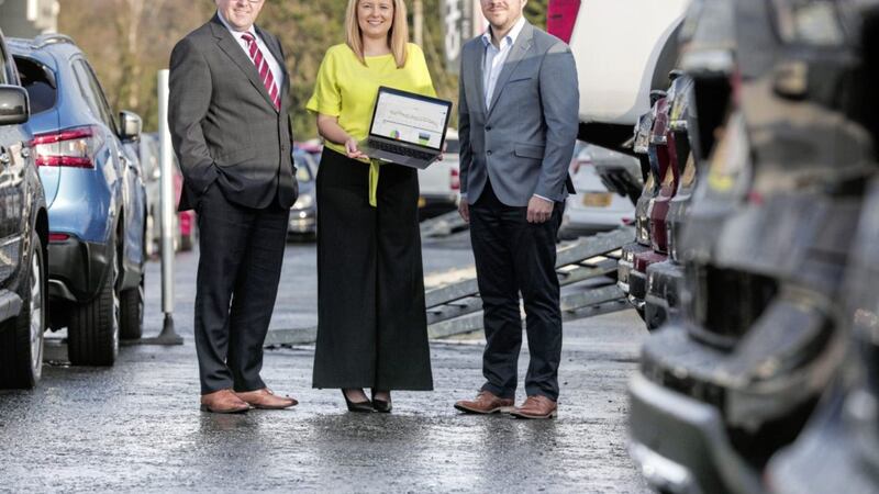 Shelbourne Motors director Paul Ward with Scaffold Digital project manager Sarah-Jane McAdam and managing director Tim Proctor 