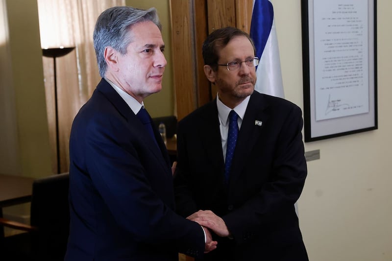 Antony Blinken shakes hands with Israeli President Isaac Herzog