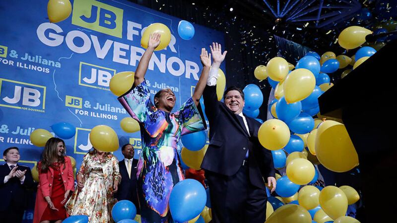 &nbsp;Democratic gubernatorial candidate JB&nbsp;Pritzker, right, and his running mate Lt Governor candidate Juliana Stratton celebrate as they wave to supporters after Pritzker is elected as Illinois governor over Republican incumbent Bruce Rauner in Chicago yesterday. Picture by Nam Y&nbsp;Huh, AP