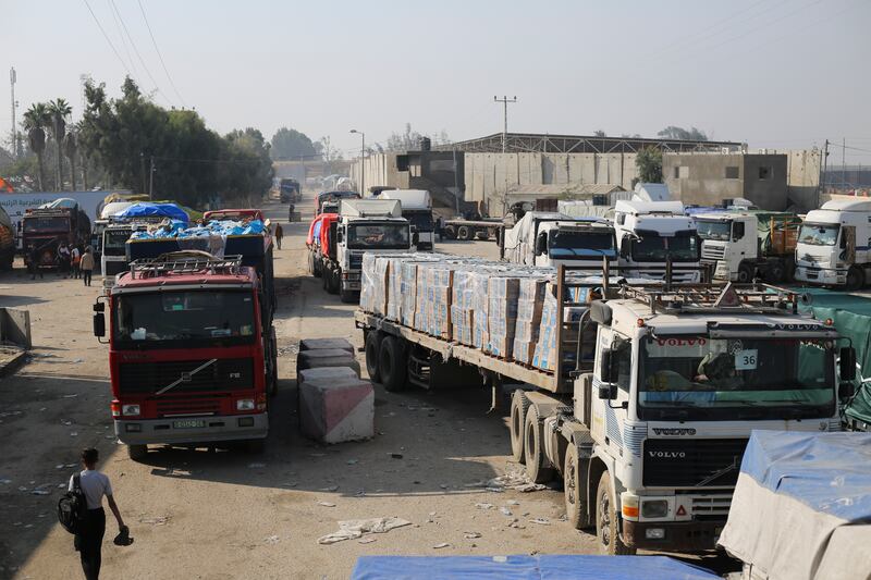 Humanitarian aid trucks enter through the Kerem Shalom crossing (Hatem Ali/AP)
