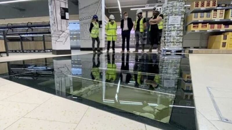 Remains of an 11th century house can be seen beneath a glass section of the floor of the Lidl store. Picture by RT&Eacute; 