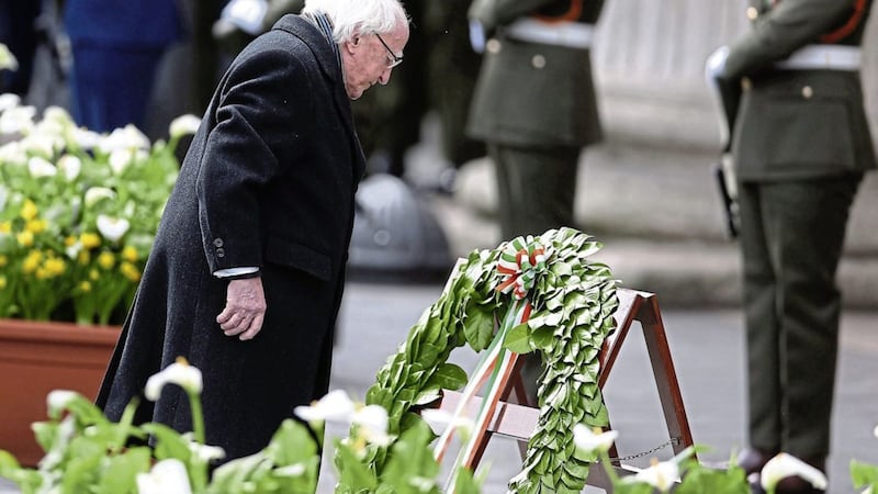 Michael D Higgins lays a wreath during a ceremony to mark the 101st anniversary of the 1916 Easter Rising outside the GPO, in O&#39;Connell Street, Dublin PICTURE: Brian Lawless/PA 