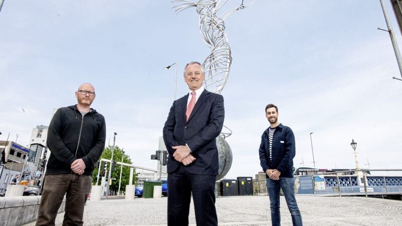 Whitespace&#39;s head of engineering Glenn McClements (left) and head of design Russell Kane with Invest NI chief executive Kevin Holland 