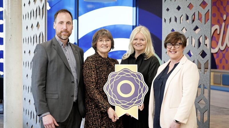 Allstate NI&#39;s vice president and managing director Dr Stephen McKeown, senior manager Lesley Miller (second left) and IDE Manager Susan Walker (right) receive the Gold Diversity Mark from Diversity Mark director Nuala Murphy. Picture: Kelvin Boyes/PressEye 