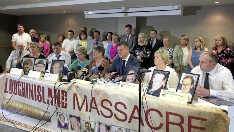 Solicitor Niall Murphy with relatives of those killed in Loughinland. 