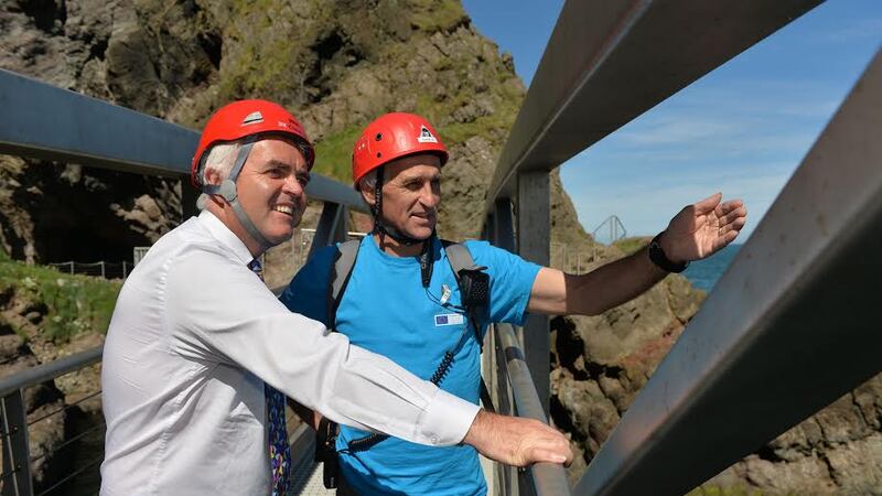 Tourism Minister, Jonathan Bell, is pictured with Tour Guide Robert Stewart attending a special preview event of The Gobbins Cliff Path &nbsp;