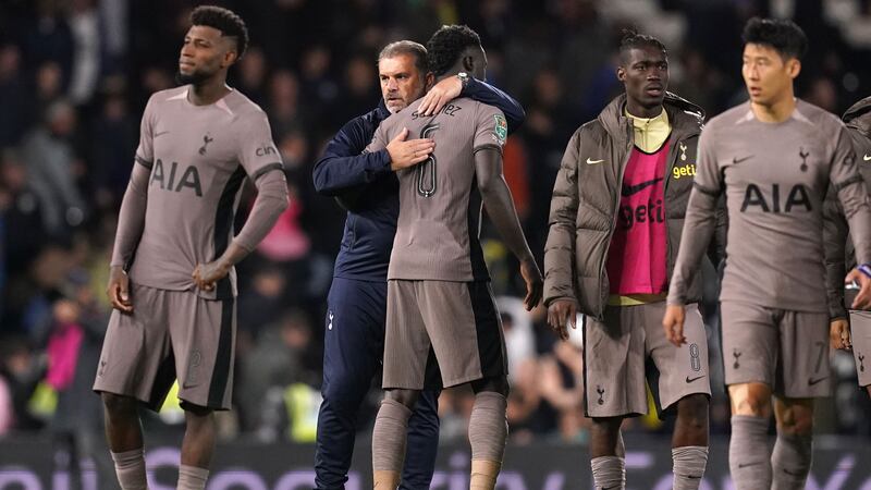 Tottenham’s Davinson Sanchez is consoled by manager Ange Postecoglou after the Carabao Cup second round defeat to Fulham (John Walton/PA)