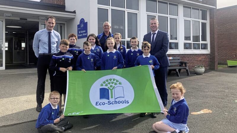 Eco-schools co-ordinator Rory Mason (left), building supervisor Robbie Fitzsimons (centre) and principal Kevin Burns (right) with pupils from St Nicholas&rsquo; Primary School in Ardglass  