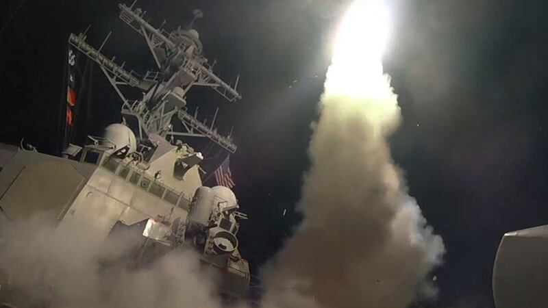 In this image provided by the US Navy, the guided-missile destroyer USS Porter (DDG 78) launches a tomahawk land attack missile in the Mediterranean Sea, Friday, April 7, 2017&nbsp;